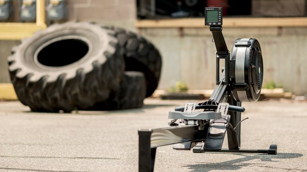 A BikeERg and tire outside a gym