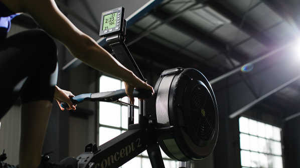 Dramatic picture of rowing in a gym